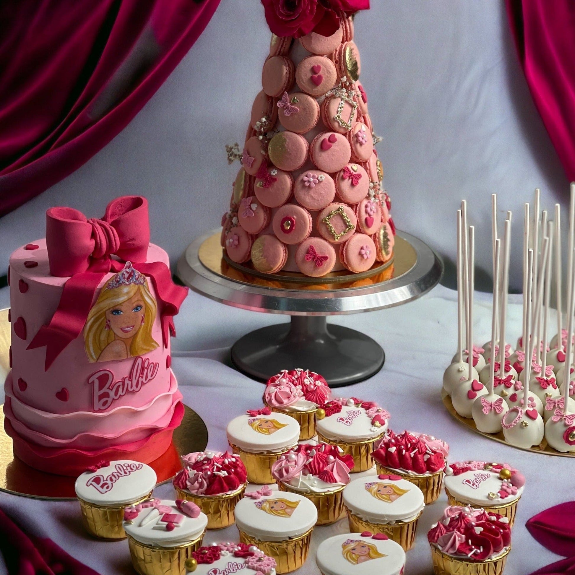 A collection of Barbie-themed cakes featuring intricate designs and vibrant colors, perfect for princess-themed parties and special occasions.